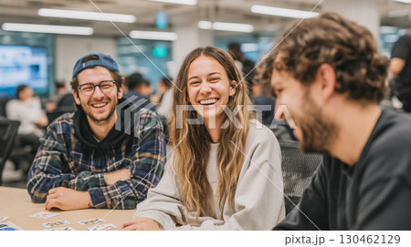 Colleagues share laughter and joy during a quick game in the office 130462129