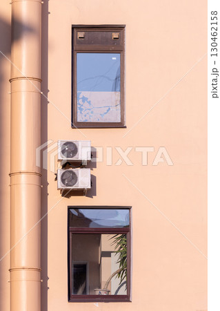 air conditioners are mounted on the wall. technologies for air cooling in hot weather. 130462158
