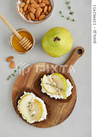 Bruschetta with cream cheese, honey, pear, thyme Bruschetta with cream cheese, honey, pear, thyme 130462451