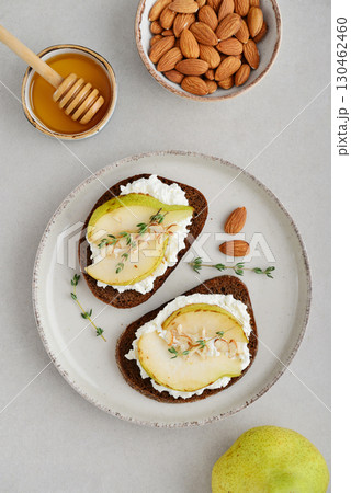 Bruschetta with cream cheese, honey, pear, thyme Bruschetta with cream cheese, honey, pear, thyme 130462460