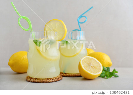 Two glasses of homemade lemonade with drinking straws Two glasses of homemade lemonade with drinking straws 130462481