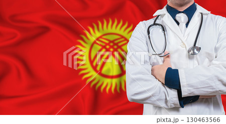 Male doctor with stethoscope on Kyrgyzstan flag. Doctor holding stethoscope on Kyrgyzstan flag 130463566