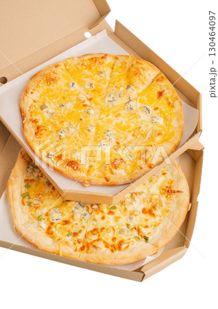 Two pizzas in a cardboard box with cheese, and the second with cheese and chicken. Pizza isolated. Two pizzas in a cardboard box with cheese, and the second with cheese and chicken. Pizza isolated. 130464097