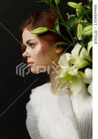 Beautiful young woman with flowers, showcasing natural beauty and elegance, perfect for spring themes, healthy lifestyle, and fashion concepts Beautiful young woman with flowers, showcasing natural beauty and elegance, perfect for spring themes, healthy lifestyle, and fashion concepts 130464449
