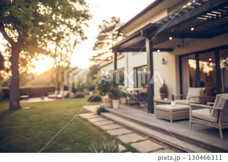 Cozy Modern Home with Scenic Garden and Soft Sunset Lighting in the Background Cozy Modern Home with Scenic Garden and Soft Sunset Lighting in the Background 130466311