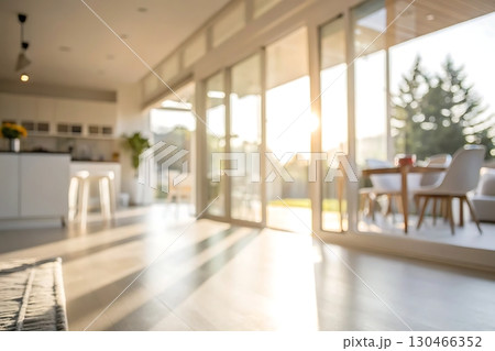 Bright Modern Home Interior with Large Windows and Sunlight Streaming Through Bright Modern Home Interior with Large Windows and Sunlight Streaming Through 130466352
