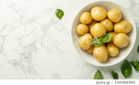 Boiled potato or steam peel on ceramic bowl in white table for real food healthy lifestyle 130466992