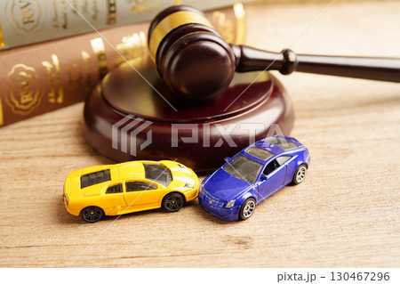 Bangkok, Thailand March 15, 2023 Car accident lawsuit and insurance, Judge hammer with car model. 130467296