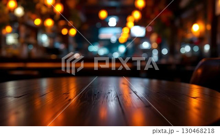 A mockup of an empty table in a cafe, featuring blurred lights in the background for a warm, inviting atmosphere 130468218