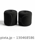 Pair of black elastic compression wraps rolled up 130468586