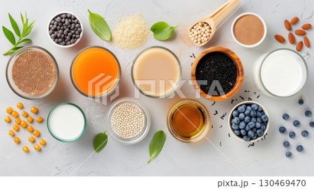 Assortment of plant-based milk alternatives and ingredients. 130469470