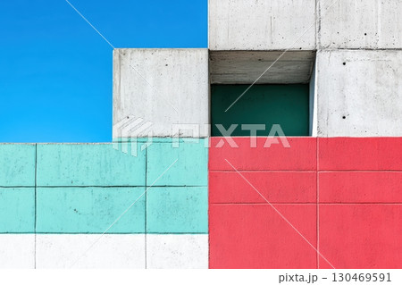 Colorful concrete wall against a bright blue sky creating a striking urban landscape in daylight 130469591