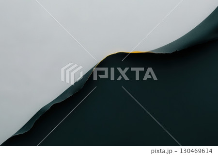 Torn paper reveals contrasting colors with smooth edges in a creative composition 130469614