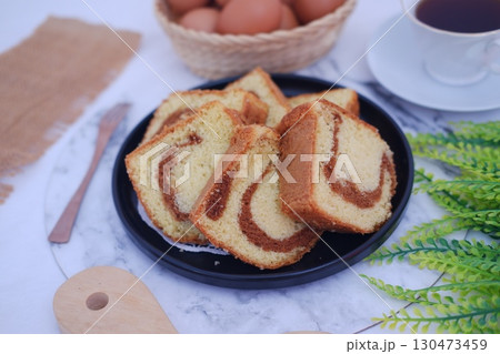 Delicious Sliced Marble Cake with Coffee and Eggs 130473459