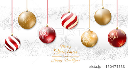 Realistic christmas ball, baubles in different designs hang on a snowy background 130475388