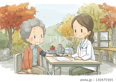 紅葉の公園で健康チェックを受ける高齢女性 130475565