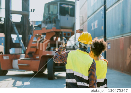 People in container port, Customs team at container yard, Cargo Import Export. Logistics industry. People in container port, Customs team at container yard, Cargo Import Export. Logistics industry. 130475847