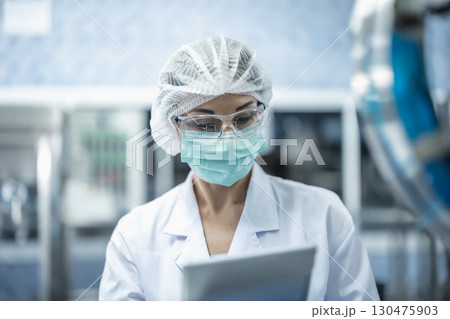 Industry inspector team working, QC staff work checking machine operation for safety and hygiene Industry inspector team working, QC staff work checking machine operation for safety and hygiene 130475903