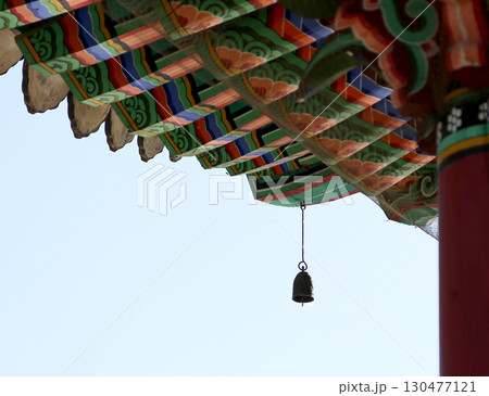 Colorful traditional architecture with bell at temple against clear blue sky 130477121