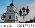 Historic church building with domed roof against clear blue sky in a vibrant town 130477181