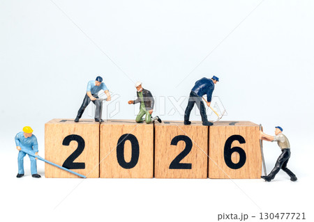 Miniature Construction Workers Building Nthe number 2026 Wooden Number Blocks 130477721