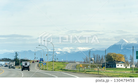 View of rural canada on Highway from Abbotsford to Hope,   BC, Canada with mountains, valleys and farms in the background 130479458