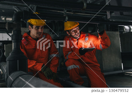 Two professional engineer male teamwork service maintenance, Worker industry water pipe tube system 130479552