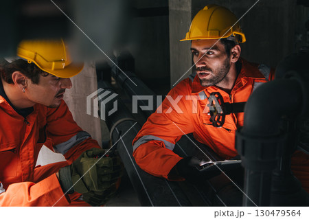 Two professional engineer male teamwork service maintenance, Worker industry water pipe tube system Two professional engineer male teamwork service maintenance, Worker industry water pipe tube system 130479564