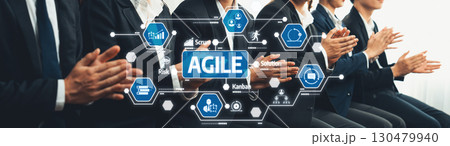 Business team in suits applauding an Agile training session, showcasing digital transformation and innovation in a professional environment.. Amity 130479940