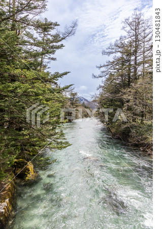 Scenic and tranquil setting in Kamikochi, part of chubu sangaku national park in Japan Scenic and tranquil setting in Kamikochi, part of chubu sangaku national park in Japan 130481843