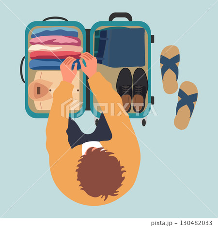 Traveler packing suitcase with clothes and shoes on light blue background. View from above 130482033