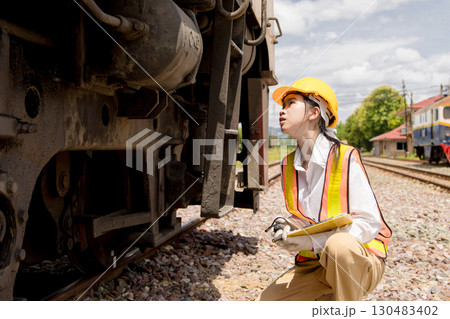 Asian young teen engineer worker work in Train station, Old locomotive service maintenance Asian young teen engineer worker work in Train station, Old locomotive service maintenance 130483402