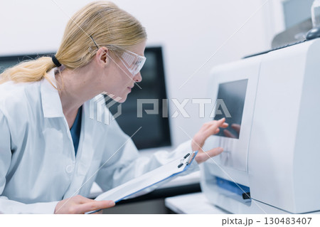 Scientist working in science lab. Medical lab people, Pharmaceutical medicine research laboratory. Scientist working in science lab. Medical lab people, Pharmaceutical medicine research laboratory. 130483407