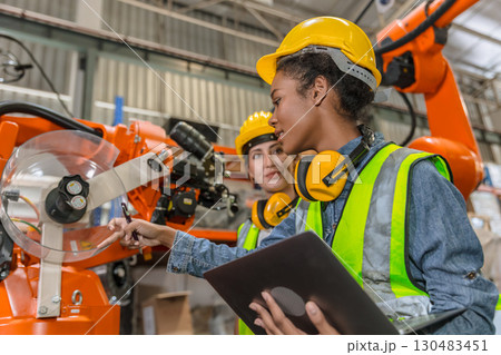 robotic engineer training, technician work in factory industry robot welding arm machine control robotic engineer training, technician work in factory industry robot welding arm machine control 130483451