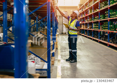 warehouse staff worker man work in cargo warehouse for logistics shipping products supply industry warehouse staff worker man work in cargo warehouse for logistics shipping products supply industry 130483467