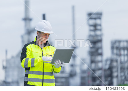 Professional Refinery Engineer working at petroleum plant, Oil and gas fossil energy business industry development. Professional Refinery Engineer working at petroleum plant, Oil and gas fossil energy business industry development. 130483498