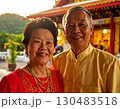 Elderly couple embraced happily smiling in front of temple at sunset 130483518