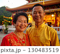 Elderly couple embraced happily smiling in front of temple at sunset 130483519