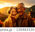 Elderly couple embraced happily smiling in front of temple at sunset 130483520