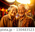 Elderly couple embraced happily smiling in front of temple at sunset 130483523