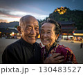 Elderly couple embraced happily smiling in front of beautiful landscape. 130483527