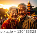 Elderly couple embraced happily smiling in front of temple at sunset 130483528