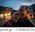 Elderly couple embraced happily smiling in front of temple at sunset 130483530