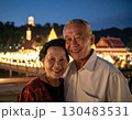 Elderly couple embraced happily smiling in front of temple at sunset 130483531