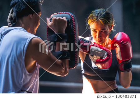 Thai boxing, Women fighter training kick boxing with trainer in ruin building ,Asian martial arts 130483871