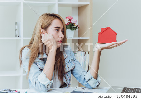 Young women teen in business office looking at home serious stress moody worry bill house expense 130484593