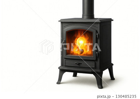 A stove in which a glowing light bulb burns. Space for text. 130485235