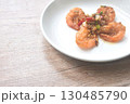 deep fried salty river shrimp with chop garlic and chili pepper arranging on plate  130485790