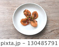 deep fried salty river shrimp with chop garlic and chili pepper arranging on plate  130485791