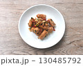 deep fried salty pork sausage with chop garlic and chili pepper arranging on plate  130485792